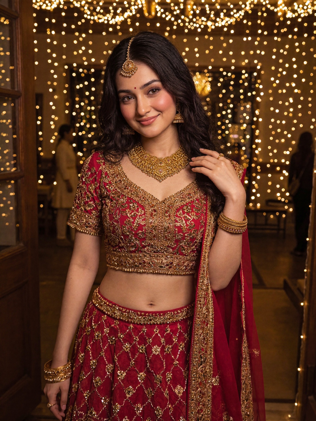 Siya in a red festive lehenga with gold jewellery