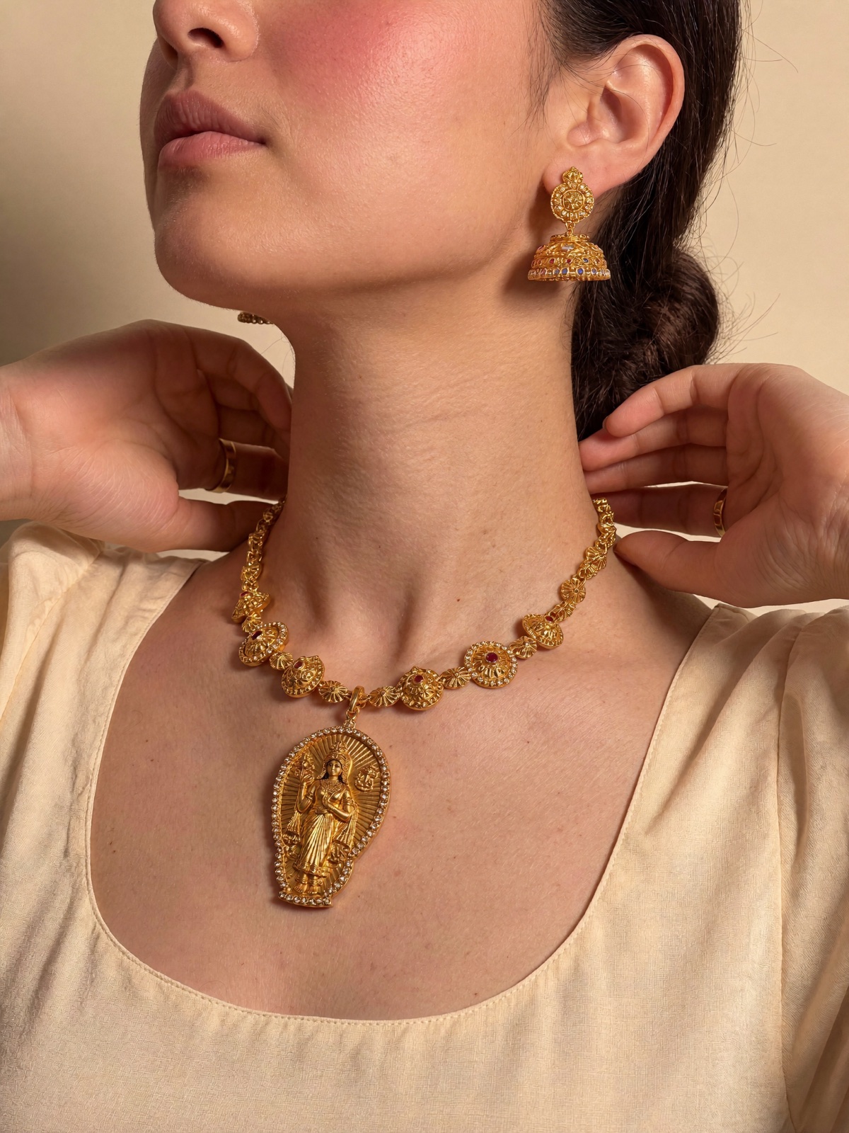 Close-up of gold temple jewellery on Siya